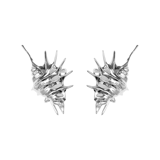 Seashell Ear Cuff — silver seashell-shaped ear cuff with smooth, flowing curves inspired by ocean waves.
