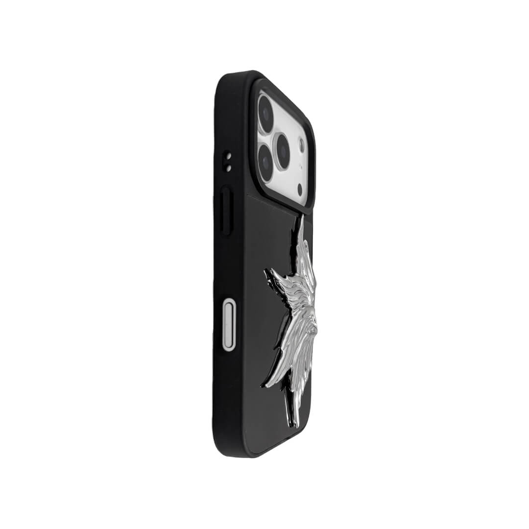 The Single Silver Angel Wing iPhone Case featuring a 3D sculpted silver metallic wing positioned on one side with an intricate feathered texture and high-shine chrome finish. Shown in three base variations: Silver, Transparent, and Black.