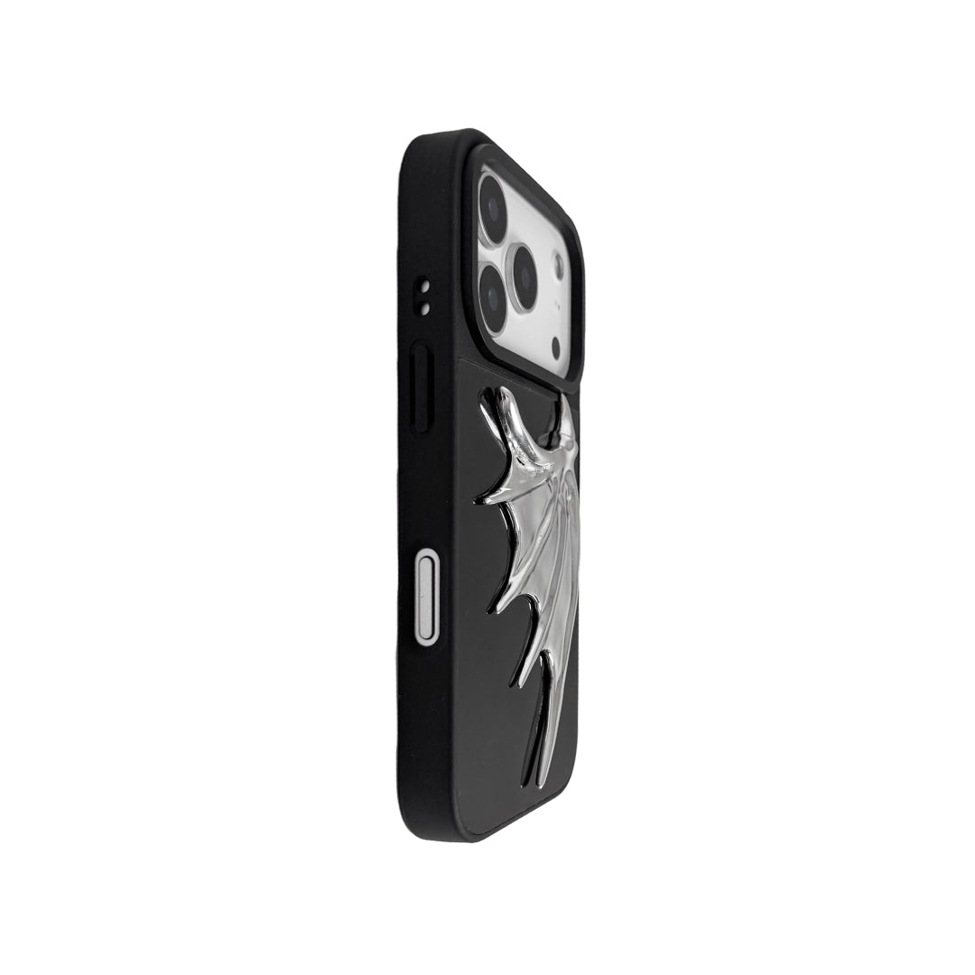 The Single Silver Demon Wing iPhone Case featuring a 3D sculpted silver metallic wing positioned on one side with a high-shine chrome finish. Shown in three base variations: Silver, Transparent, and Black.