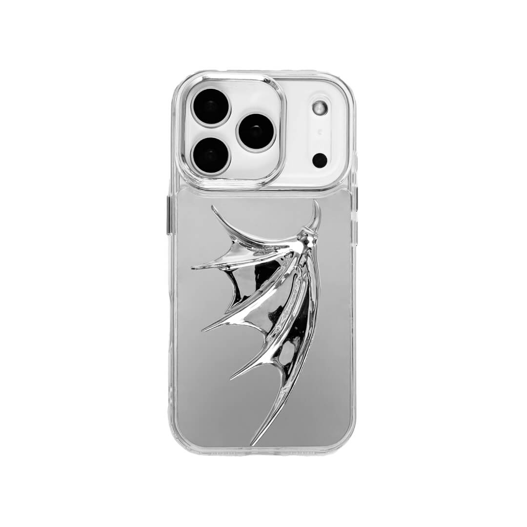 The Single Silver Demon Wing iPhone Case featuring a 3D sculpted silver metallic wing positioned on one side with a high-shine chrome finish. Shown in three base variations: Silver, Transparent, and Black.