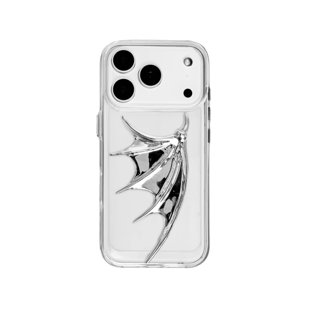 The Single Silver Demon Wing iPhone Case featuring a 3D sculpted silver metallic wing positioned on one side with a high-shine chrome finish. Shown in three base variations: Silver, Transparent, and Black.
