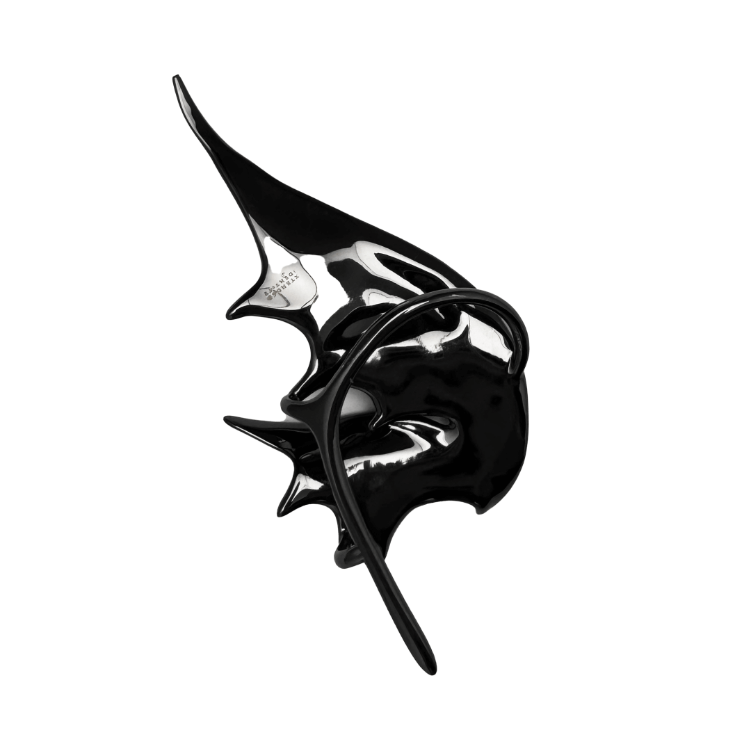 Sculptural silver ear cuffs shaped like siren-inspired wings, with a bold and futuristic design.