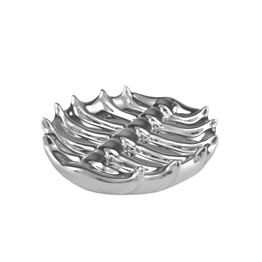 Futuristic chrome tray with 3D sculptural ribcage design – metallic anatomical totem-style centerpiece