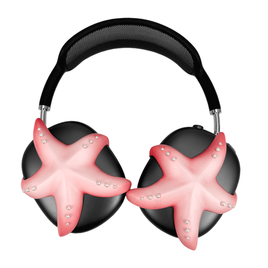 Apple over-ear headphones adorned with a metallic starfish sculpture and dot-like spheres, evoking constellations and marine elegance.