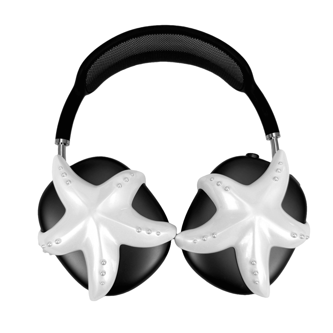 Apple over-ear headphones adorned with a metallic starfish sculpture and dot-like spheres, evoking constellations and marine elegance.
