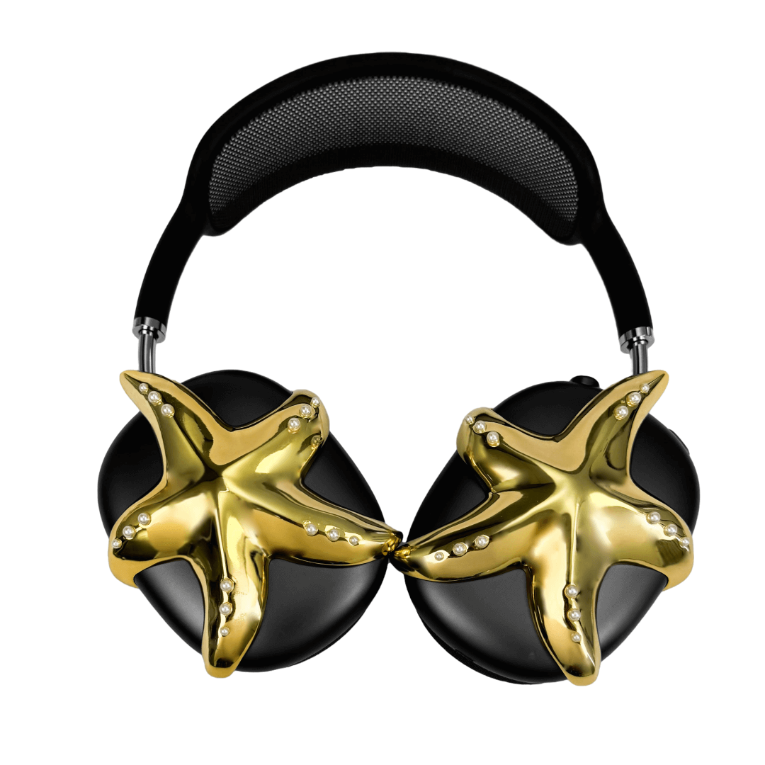 Apple over-ear headphones adorned with a metallic starfish sculpture and dot-like spheres, evoking constellations and marine elegance.