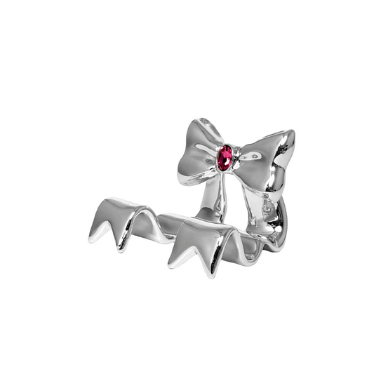 Silver bow-shaped phone stand with a red gemstone on a white background