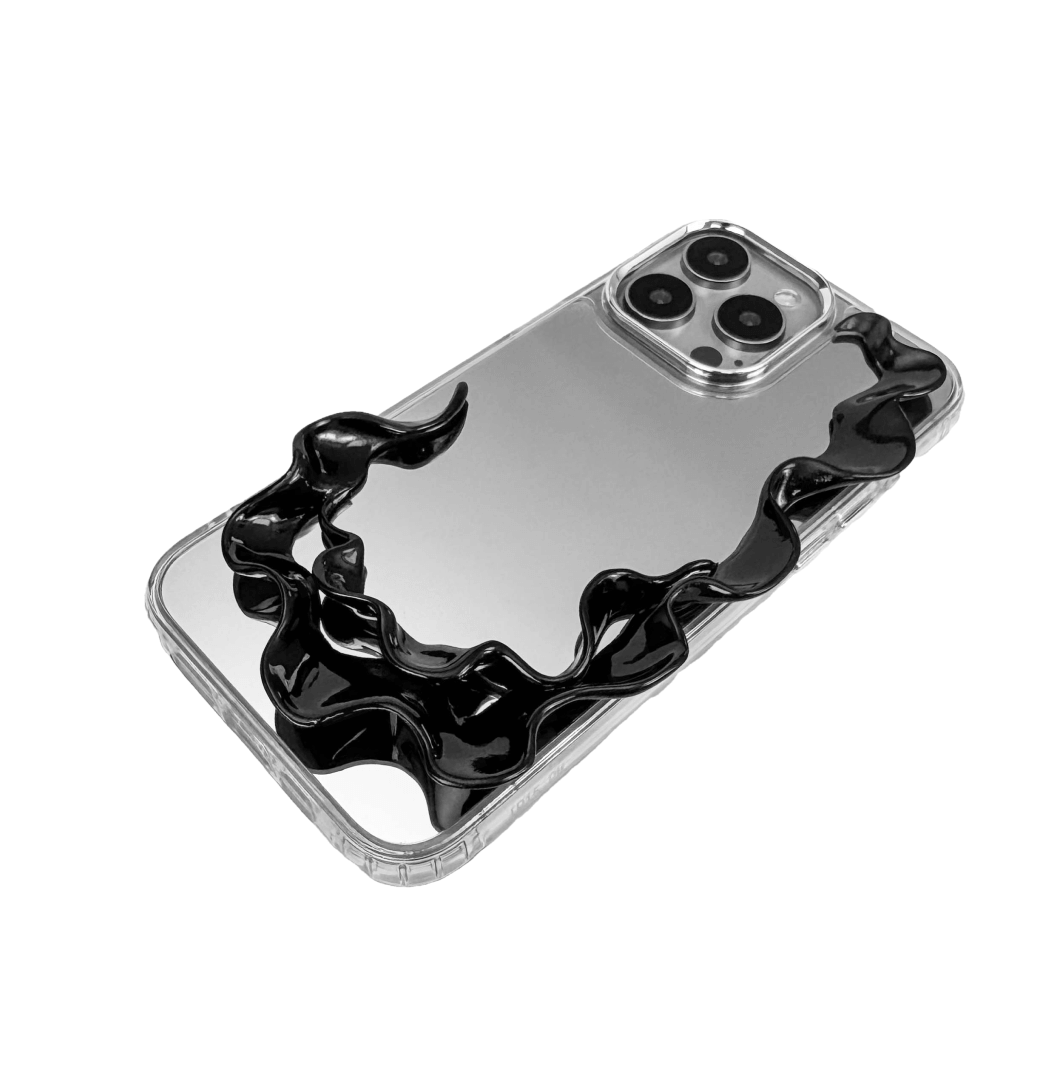 Tide Frame brings the ebb and flow of the ocean to your fingertips. This frame-style accessory encases the iPhone in a smooth, undulating silhouette, echoing the motion of water caught mid-surge. Its dark chrome finish reflects like moonlight on wet sand — a boundary that moves with the tide.

Not just a case, but a sculptural halo for your device. Every edge is alive with rhythm, every ripple a silent wave. Where protection meets poetry, Tide Frame is an elemental invitation to touch, to move, to drift.