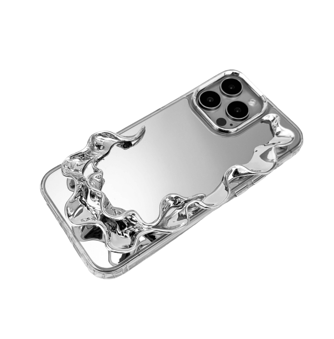 Tide Frame brings the ebb and flow of the ocean to your fingertips. This frame-style accessory encases the iPhone in a smooth, undulating silhouette, echoing the motion of water caught mid-surge. Its dark chrome finish reflects like moonlight on wet sand — a boundary that moves with the tide.

Not just a case, but a sculptural halo for your device. Every edge is alive with rhythm, every ripple a silent wave. Where protection meets poetry, Tide Frame is an elemental invitation to touch, to move, to drift.