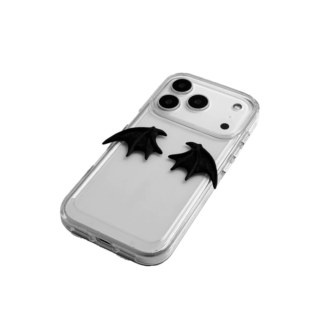 A minimalist iPhone case featuring a pair of miniature 3D-printed demon wings in a natural matte black finish. Available in two variations: a Clear Transparent base for a floating effect, and a Black Leather textured base for a rich, monochromatic Gothic aesthetic.