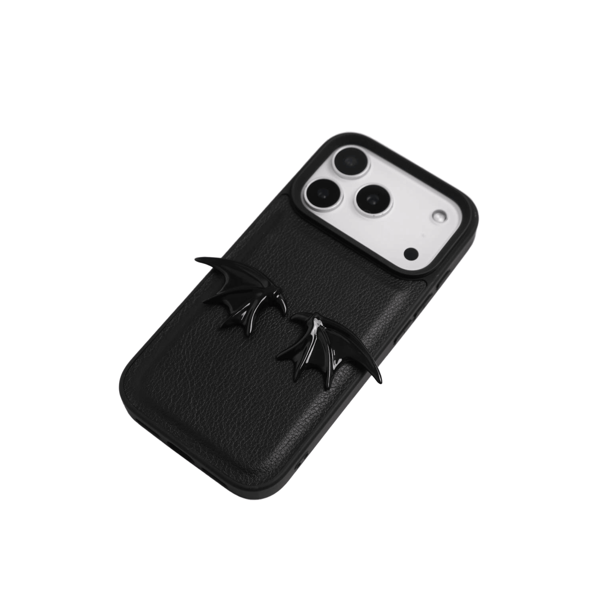 The Tiny Demon Wings iPhone Case featuring a pair of small, symmetrical 3D sculpted black bat-style wings on the lower portion of the case. Available in two base options: Crystal Clear (Transparent) and Black Lychee Leather.