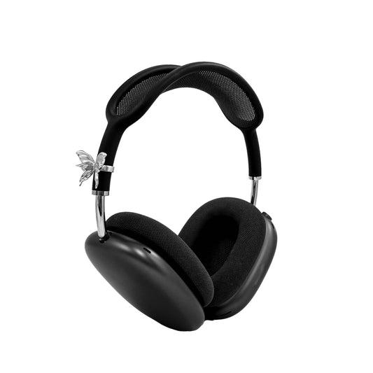 Chrome butterfly-shaped decorative accessory attached to AirPods Max.