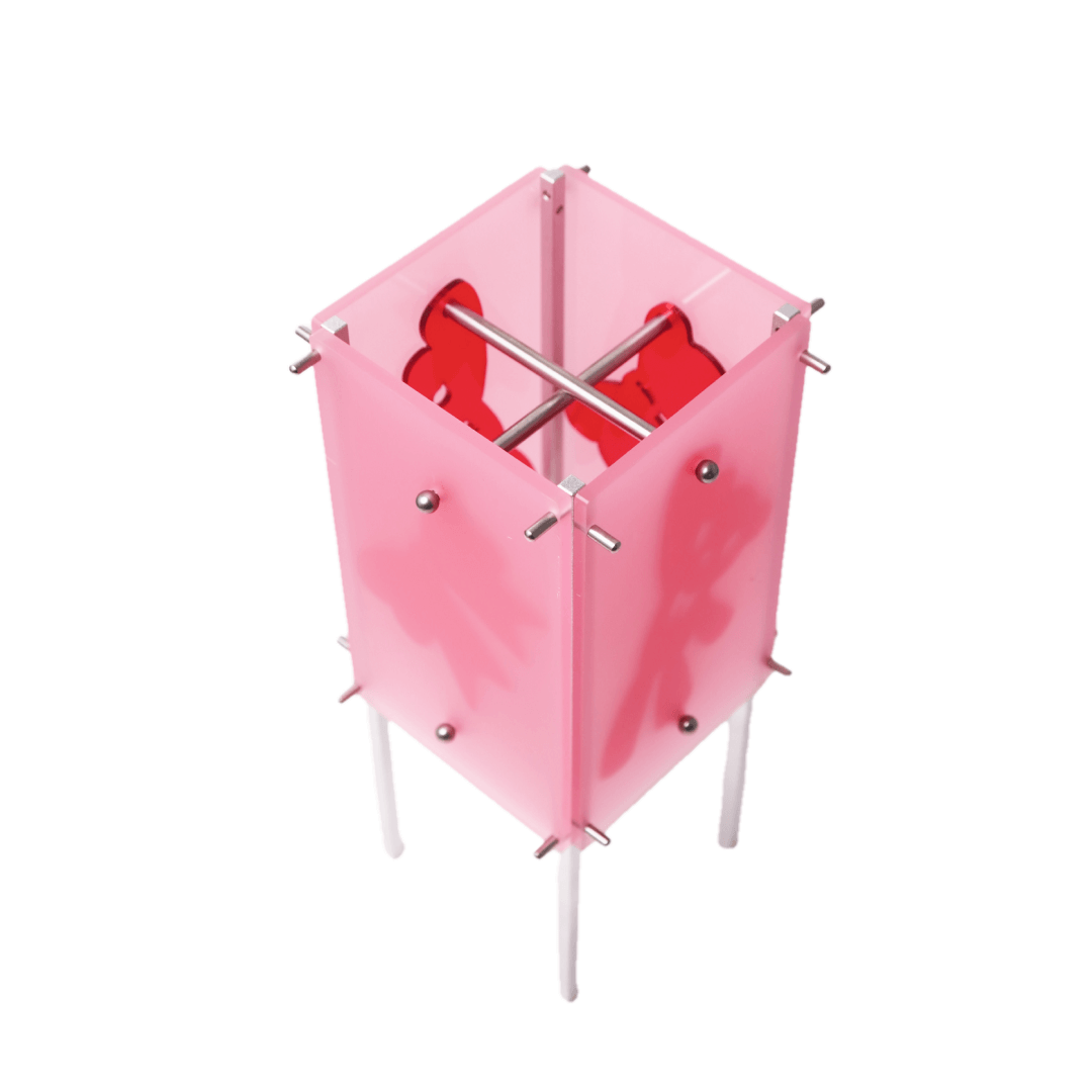 Pink hexagonal umbrella stand with red interior on a white background