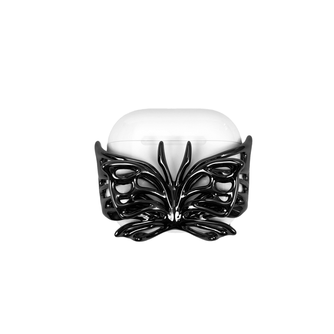 airpods cover, butterfly, sliver, gold, black, xtended identity: Sculptural black butterfly wing-shaped AirPods case cover, featuring a high-gloss noir chrome finish with intricate wing detailing, avant-garde dark fairycore tech accessory.
彫刻的な黒い蝶の羽型AirPodsケースカバー。繊細な羽のディテールを施した艶やかなノワールクローム仕上げ。先鋭的なダークフェアリーコアデザイン。