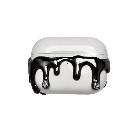 AirPods case with silver molten drip design and embedded crystals, resembling melted metal frozen mid-flow for a luxe, futuristic look.