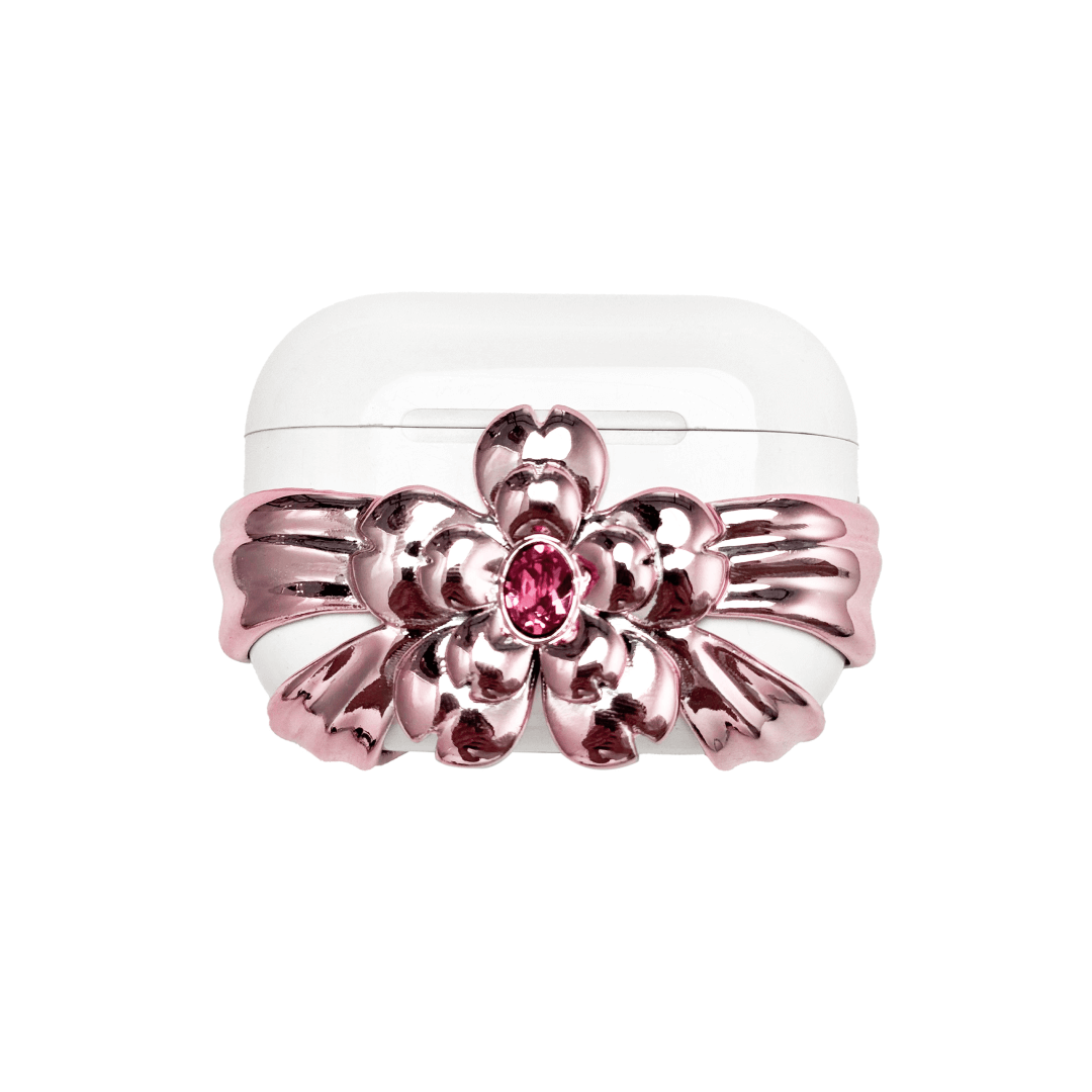 AirPods case cover with a multi-petal cherry blossom design in pink or silver, featuring a sparkling pink Swarovski crystal at the flower’s center for a refined, elegant touch.