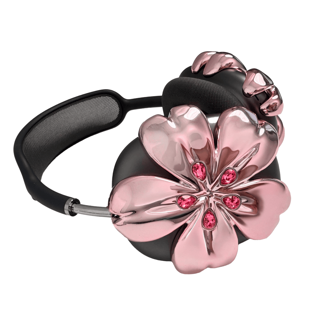 Pink cherry blossom-shaped AirPods Max covers accented with sparkling crystal embellishments, adding a luxurious floral design.