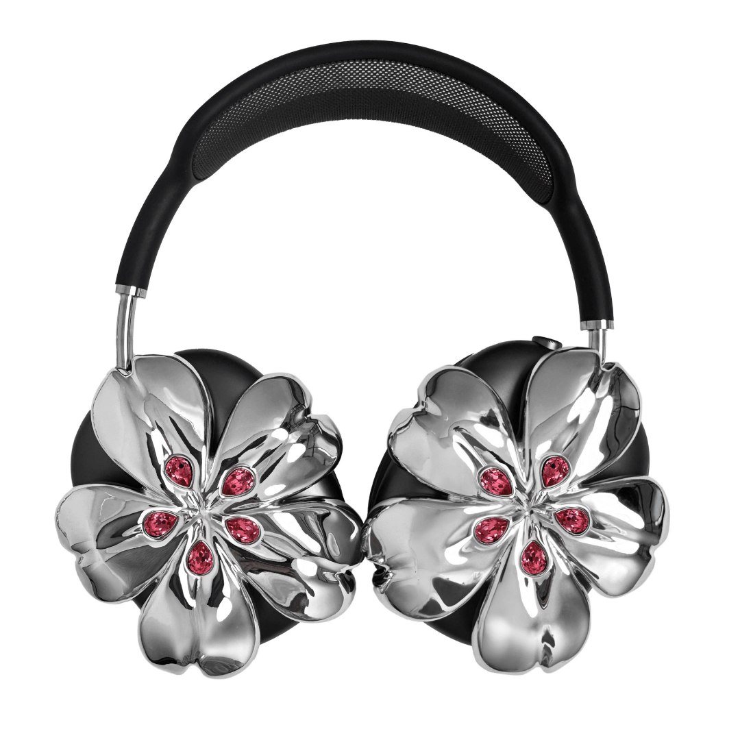 Pink cherry blossom-shaped AirPods Max covers accented with sparkling crystal embellishments, adding a luxurious floral design.