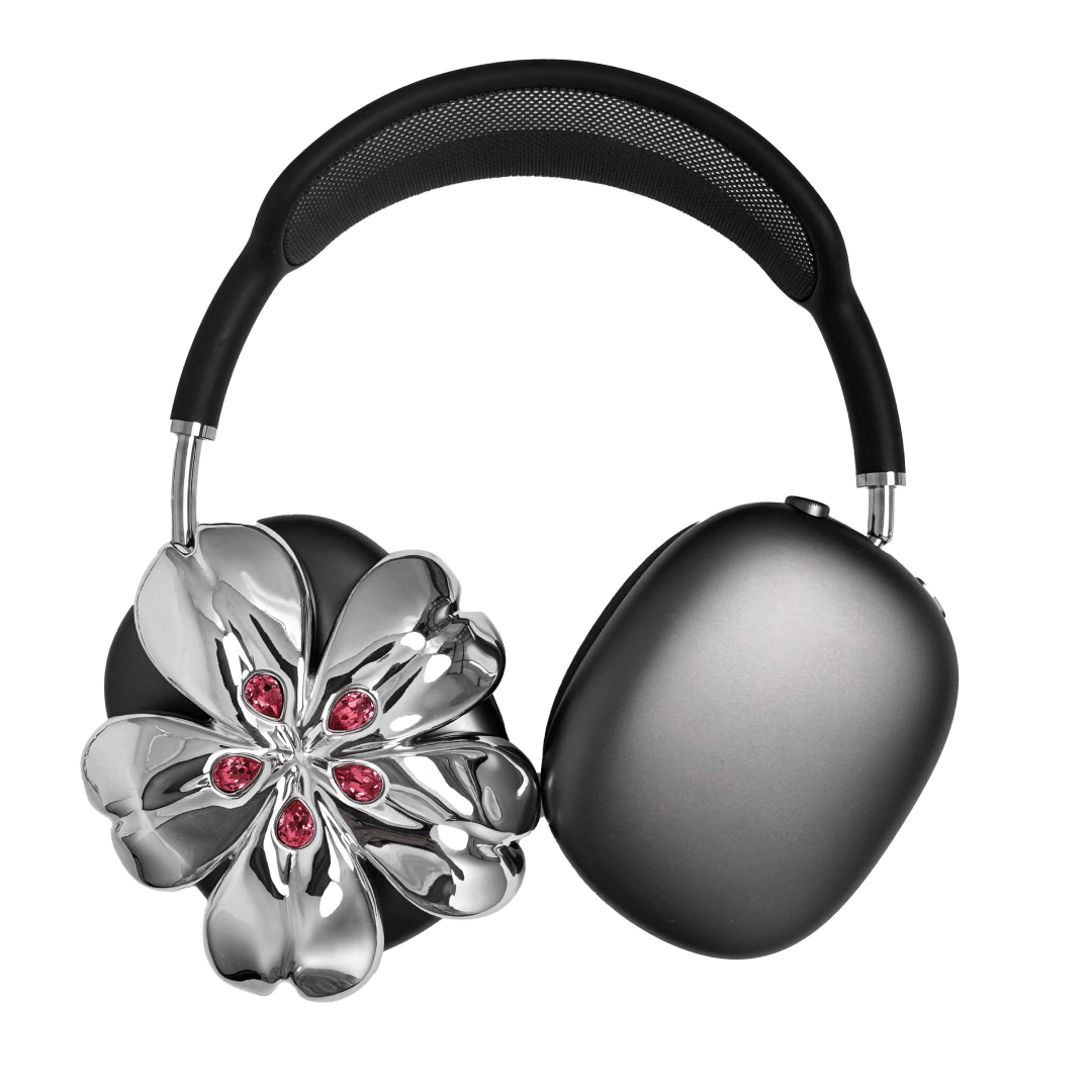 Pink cherry blossom-shaped AirPods Max covers accented with sparkling crystal embellishments, adding a luxurious floral design.
