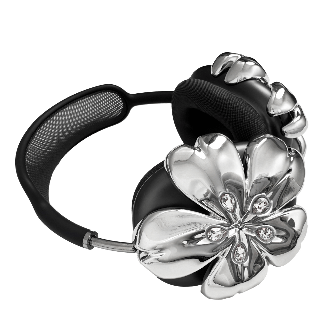 Pink cherry blossom-shaped AirPods Max covers accented with sparkling crystal embellishments, adding a luxurious floral design.