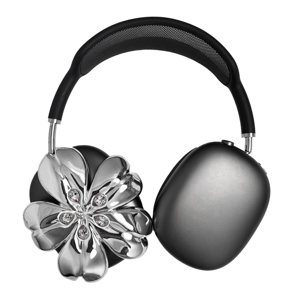 Pink cherry blossom-shaped AirPods Max covers accented with sparkling crystal embellishments, adding a luxurious floral design.