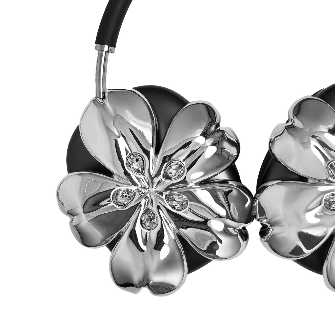 Pink cherry blossom-shaped AirPods Max covers accented with sparkling crystal embellishments, adding a luxurious floral design.