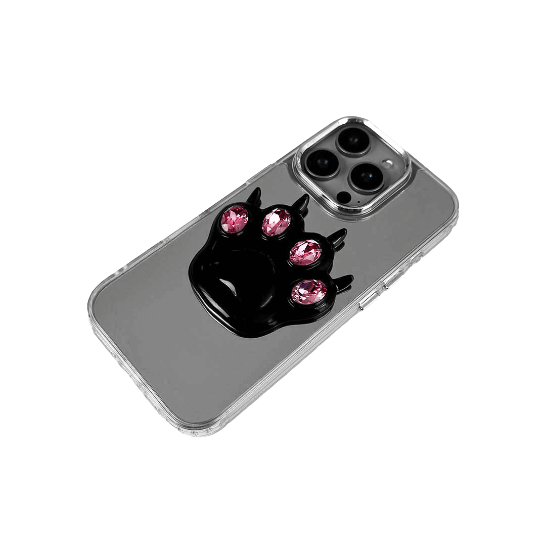 GEM CAT PAW iPhone Case with a black or silver sculpted cat paw design, set with Swarovski crystals in black, white, or pink, shown with pink crystals on a mirror-finish 