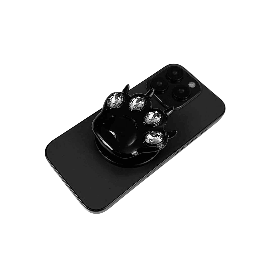 GEM CAT PAW phone grip with black or silver cat paw design, adorned with Swarovski crystals in black, white, or pink.