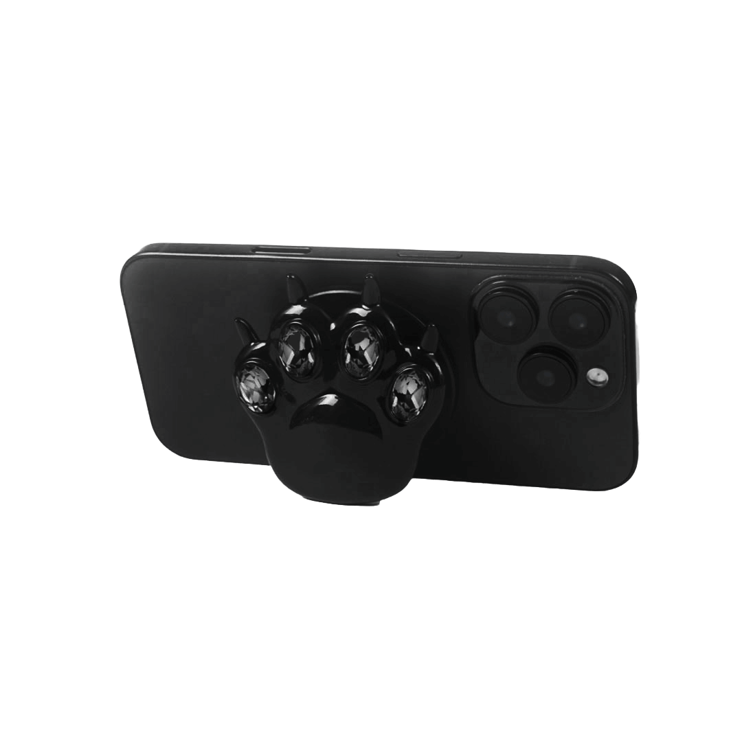 GEM CAT PAW phone grip with black or silver cat paw design, adorned with Swarovski crystals in black, white, or pink.