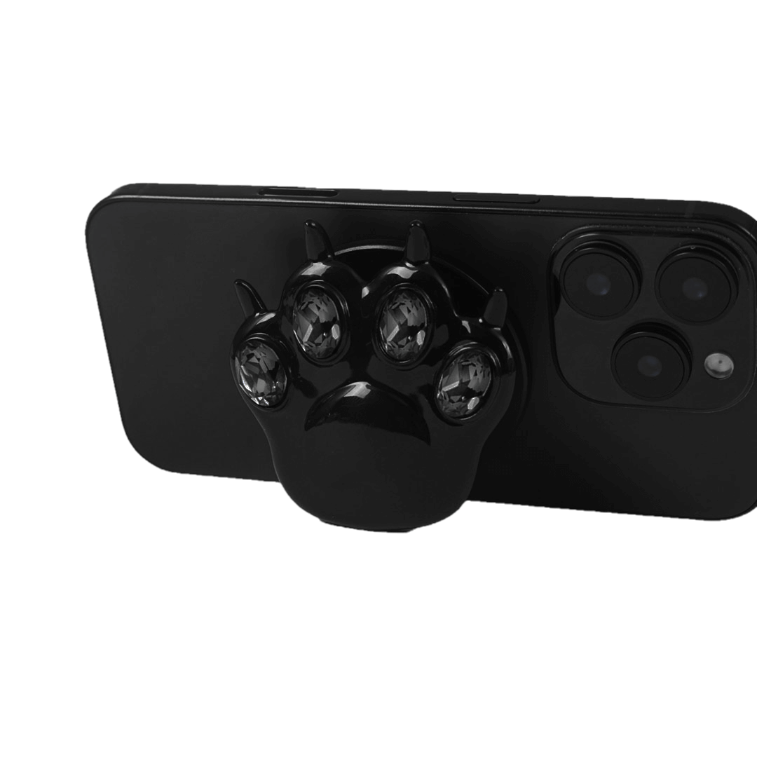GEM CAT PAW phone grip with black or silver cat paw design, adorned with Swarovski crystals in black, white, or pink.