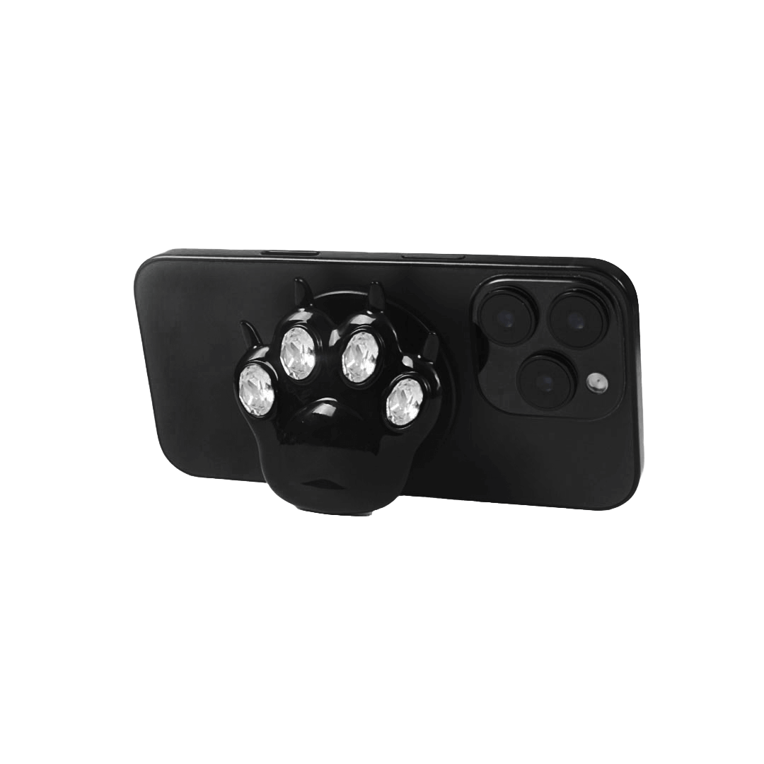 GEM CAT PAW phone grip with black or silver cat paw design, adorned with Swarovski crystals in black, white, or pink.