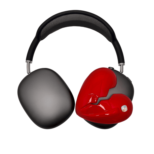 Silver, pink, red and black AirPods Max cover featuring a metallic broken heart design, with a sculpted crack down the center and small embedded crystal detail.