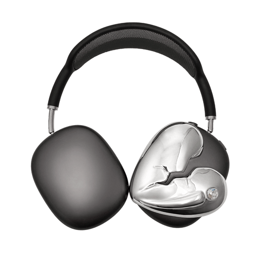 Silver, pink, red and black AirPods Max cover featuring a metallic broken heart design, with a sculpted crack down the center and small embedded crystal detail.