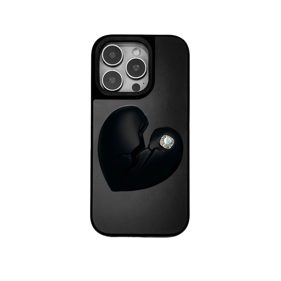 3D silver, pink, red and black metallic iPhone case featuring a cracked heart design with smooth chrome finish and a single embedded gem.