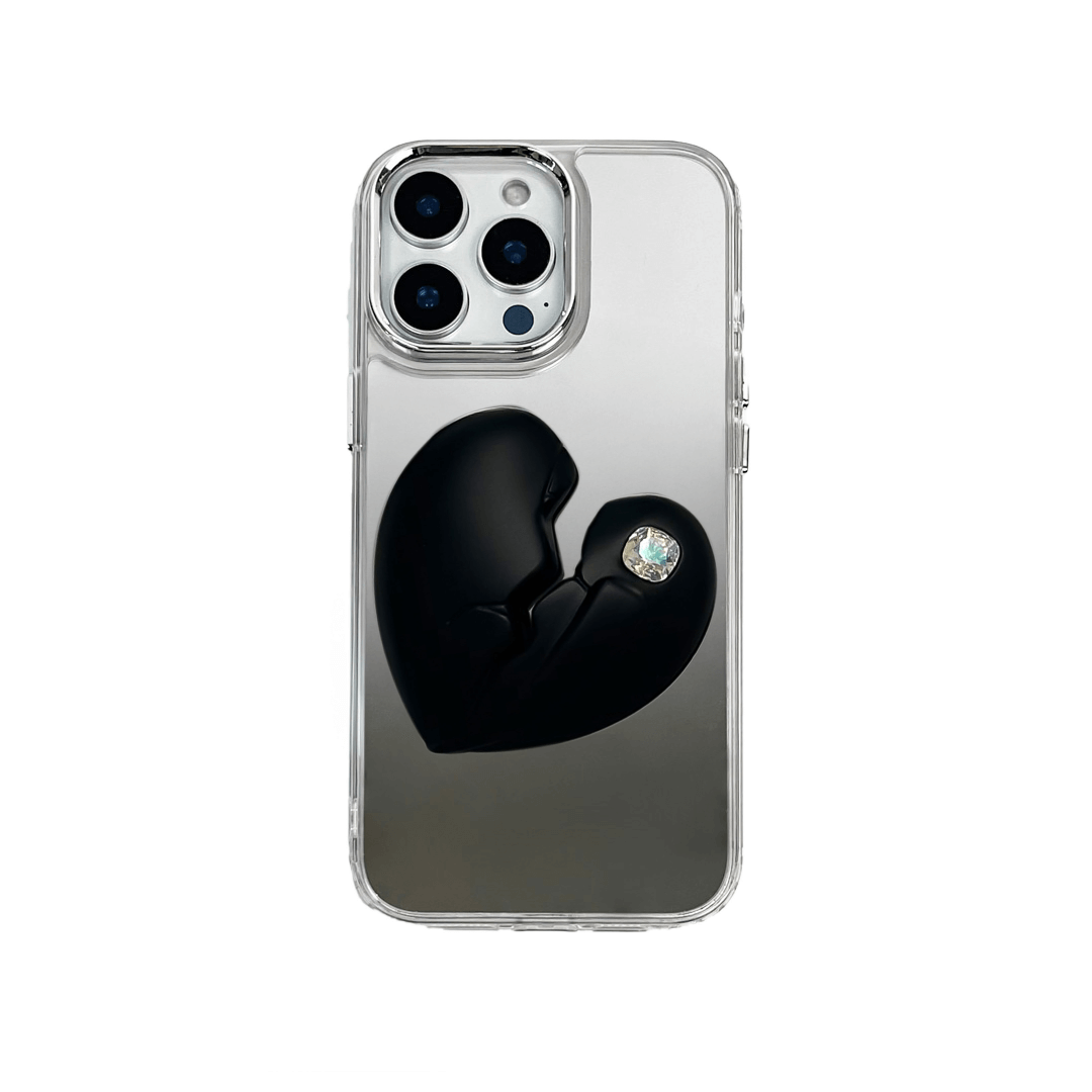 3D silver, pink, red and black metallic iPhone case featuring a cracked heart design with smooth chrome finish and a single embedded gem.