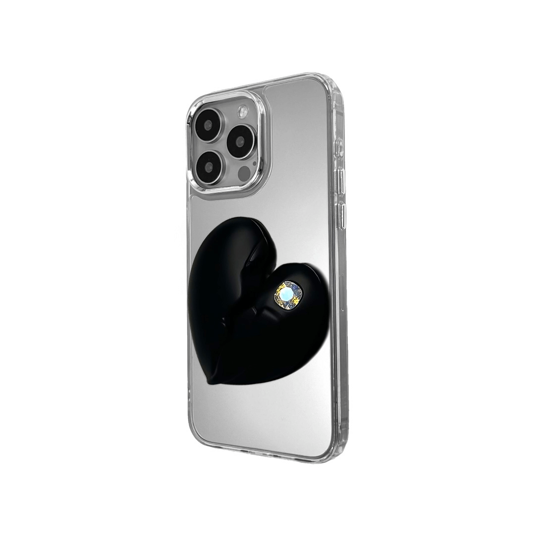 3D silver, pink, red and black metallic iPhone case featuring a cracked heart design with smooth chrome finish and a single embedded gem.