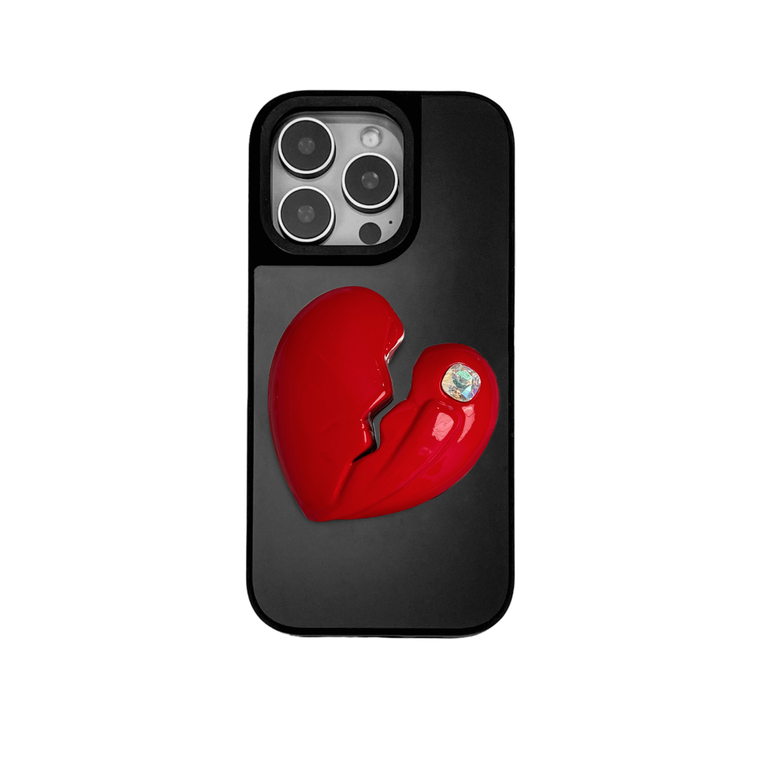 3D silver, pink, red and black metallic iPhone case featuring a cracked heart design with smooth chrome finish and a single embedded gem.