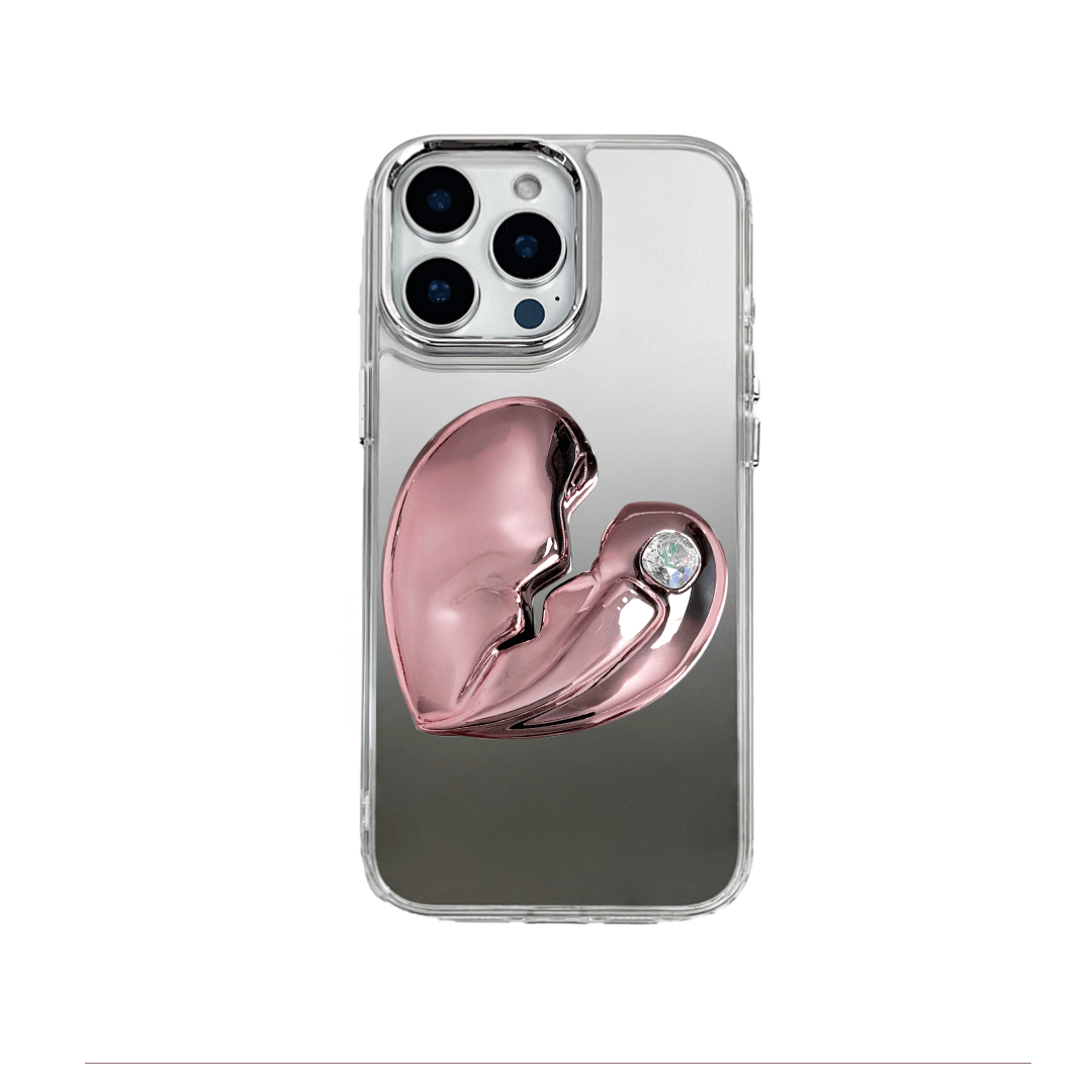 3D silver, pink, red and black metallic iPhone case featuring a cracked heart design with smooth chrome finish and a single embedded gem.