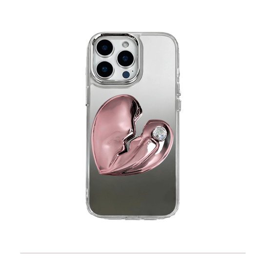 3D silver, pink, red and black metallic iPhone case featuring a cracked heart design with smooth chrome finish and a single embedded gem.