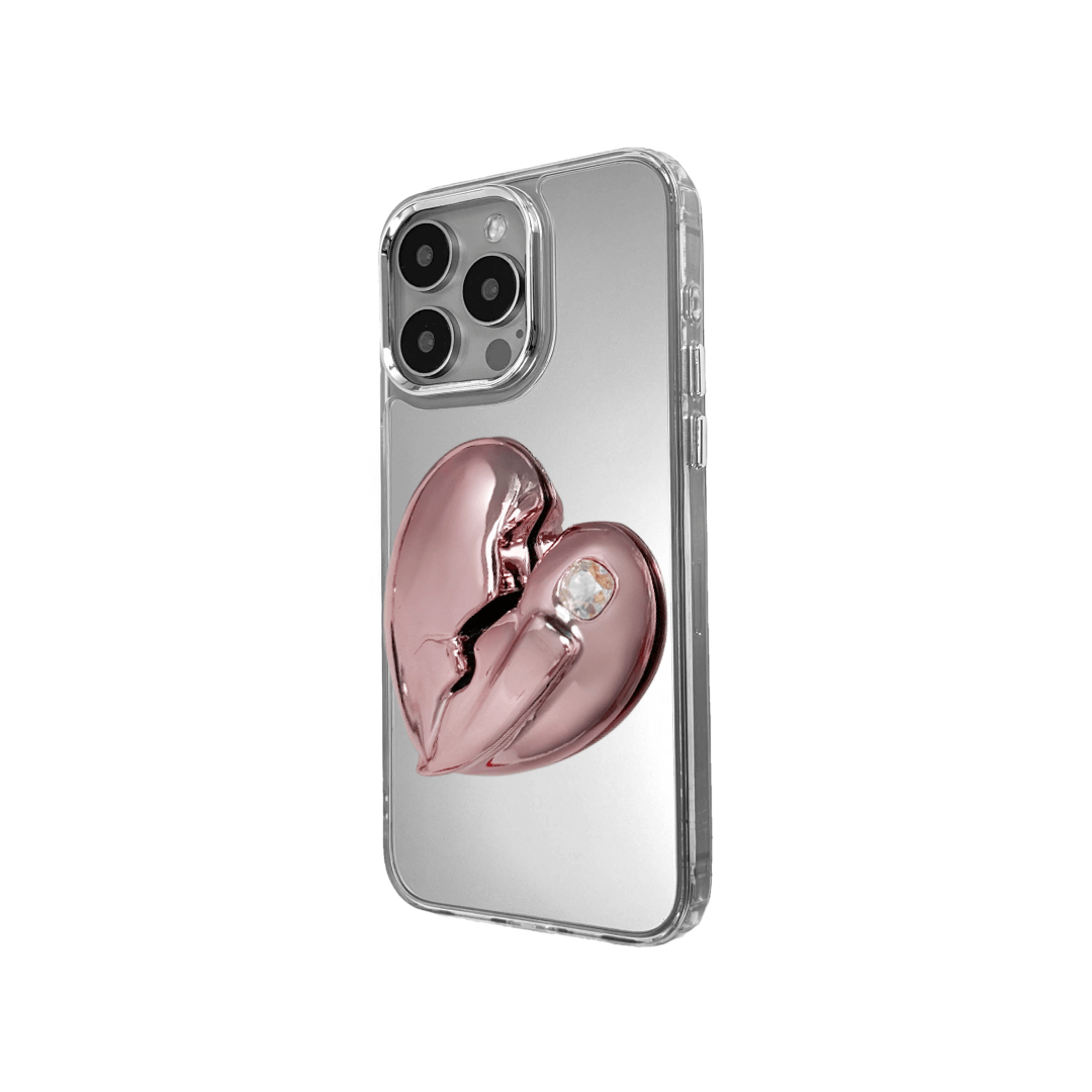 3D silver, pink, red and black metallic iPhone case featuring a cracked heart design with smooth chrome finish and a single embedded gem.