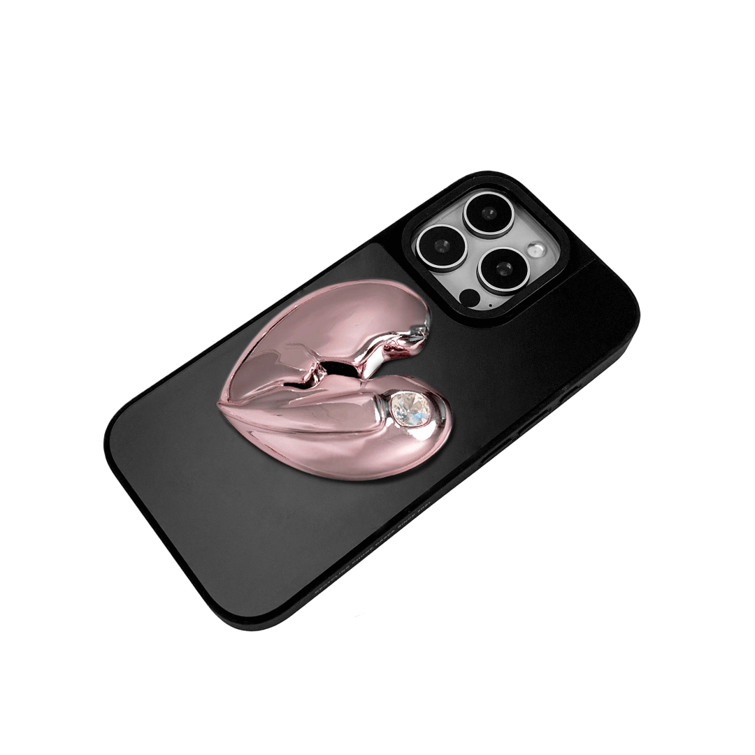 3D silver, pink, red and black metallic iPhone case featuring a cracked heart design with smooth chrome finish and a single embedded gem.
