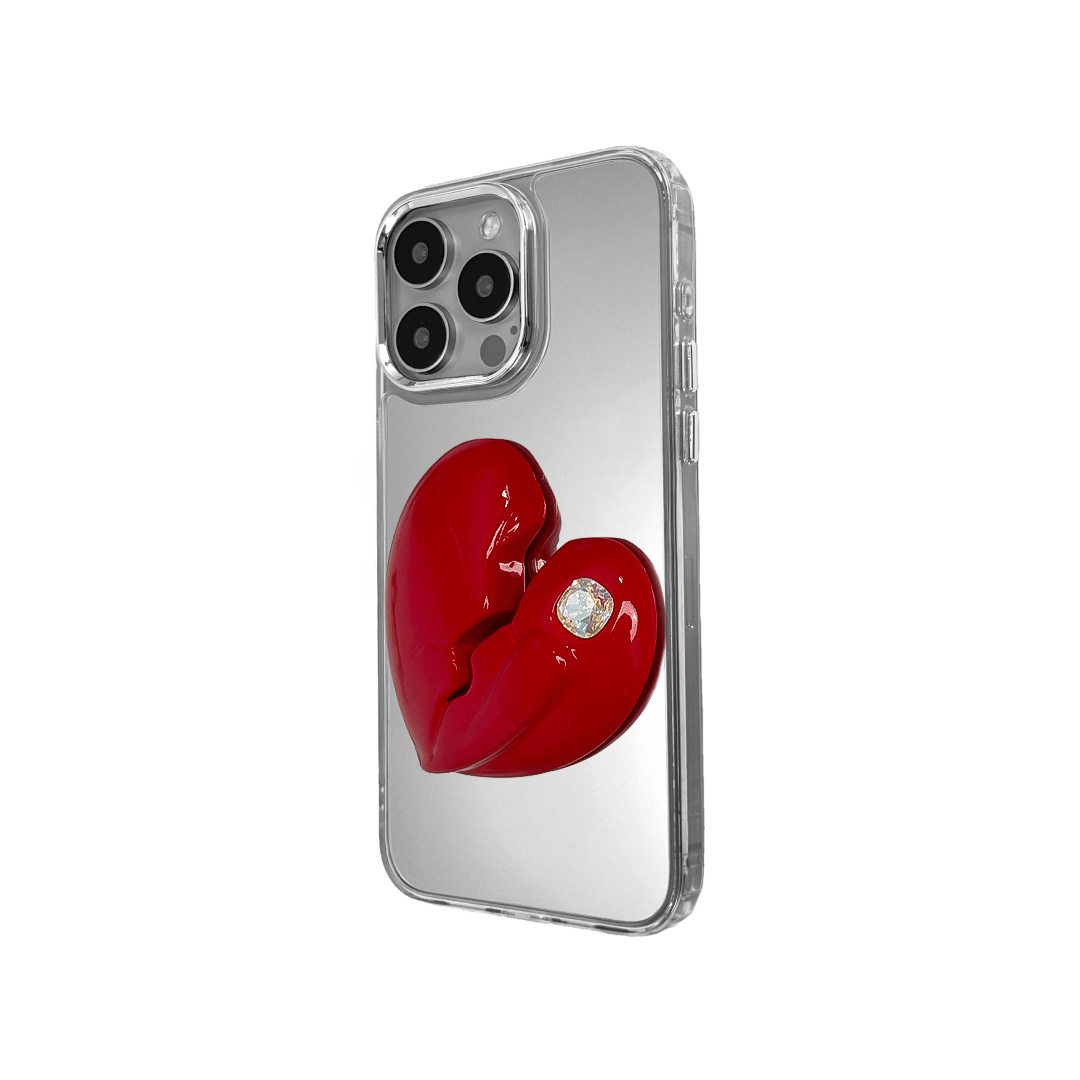 3D silver, pink, red and black metallic iPhone case featuring a cracked heart design with smooth chrome finish and a single embedded gem.