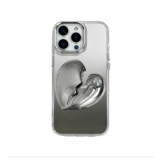 3D silver, pink, red and black metallic iPhone case featuring a cracked heart design with smooth chrome finish and a single embedded gem.