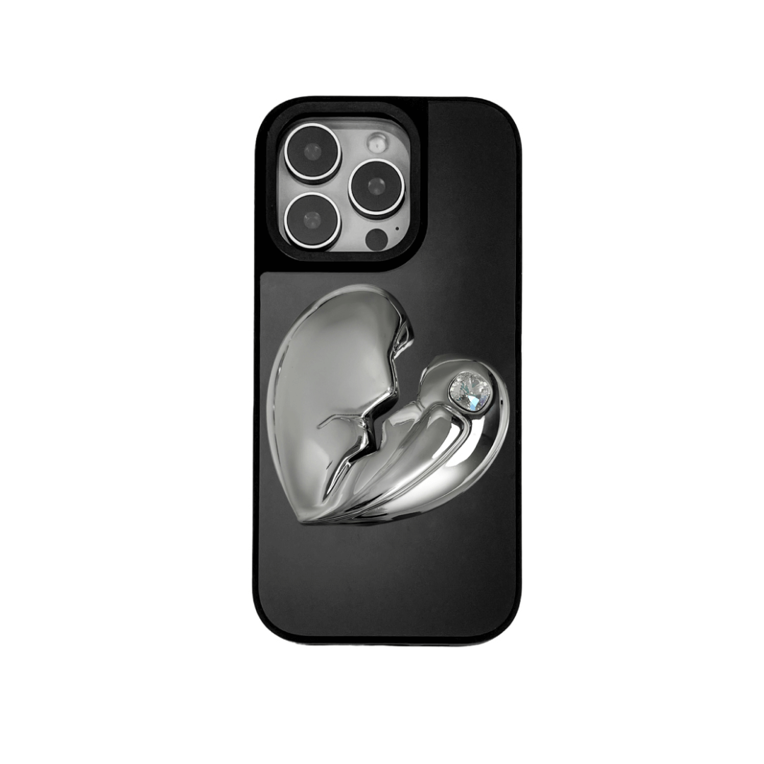 3D silver, pink, red and black metallic iPhone case featuring a cracked heart design with smooth chrome finish and a single embedded gem.