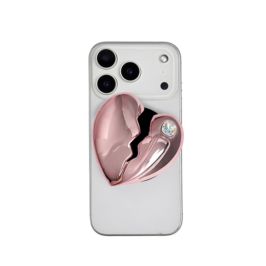 3D silver, pink, red and black metallic Phone grip featuring a cracked heart design with smooth chrome finish and a single embedded gem.