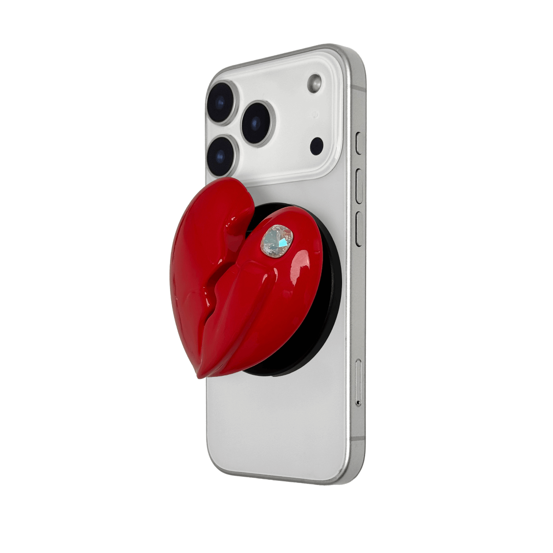 3D silver, pink, red and black metallic Phone grip featuring a cracked heart design with smooth chrome finish and a single embedded gem.