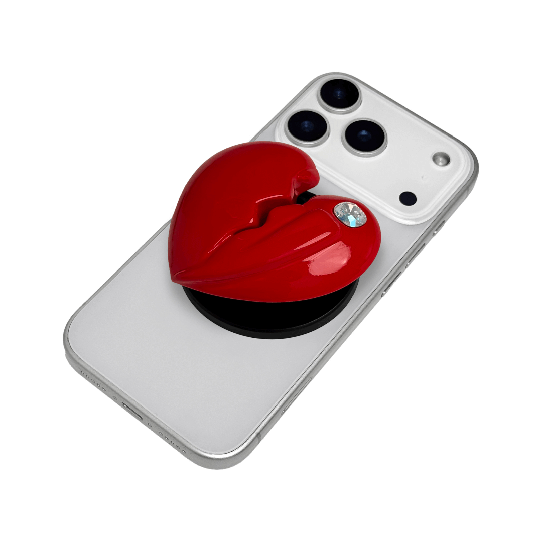3D silver, pink, red and black metallic Phone grip featuring a cracked heart design with smooth chrome finish and a single embedded gem.