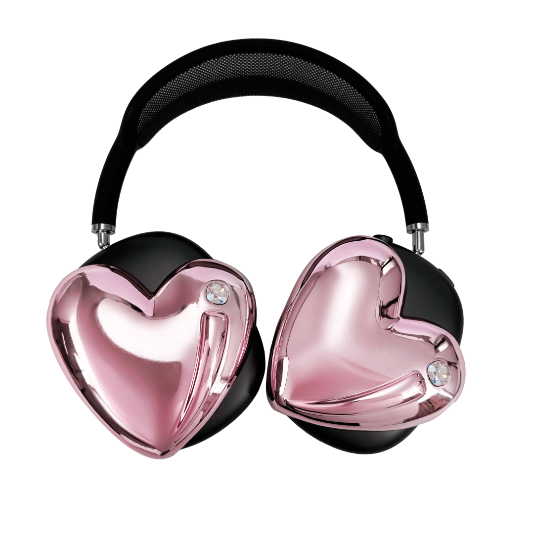 Metallic heart-shaped AirPods Max cover in silver, pink, red and black, with a smooth 3D sculpted surface and a single crystal stud detail.