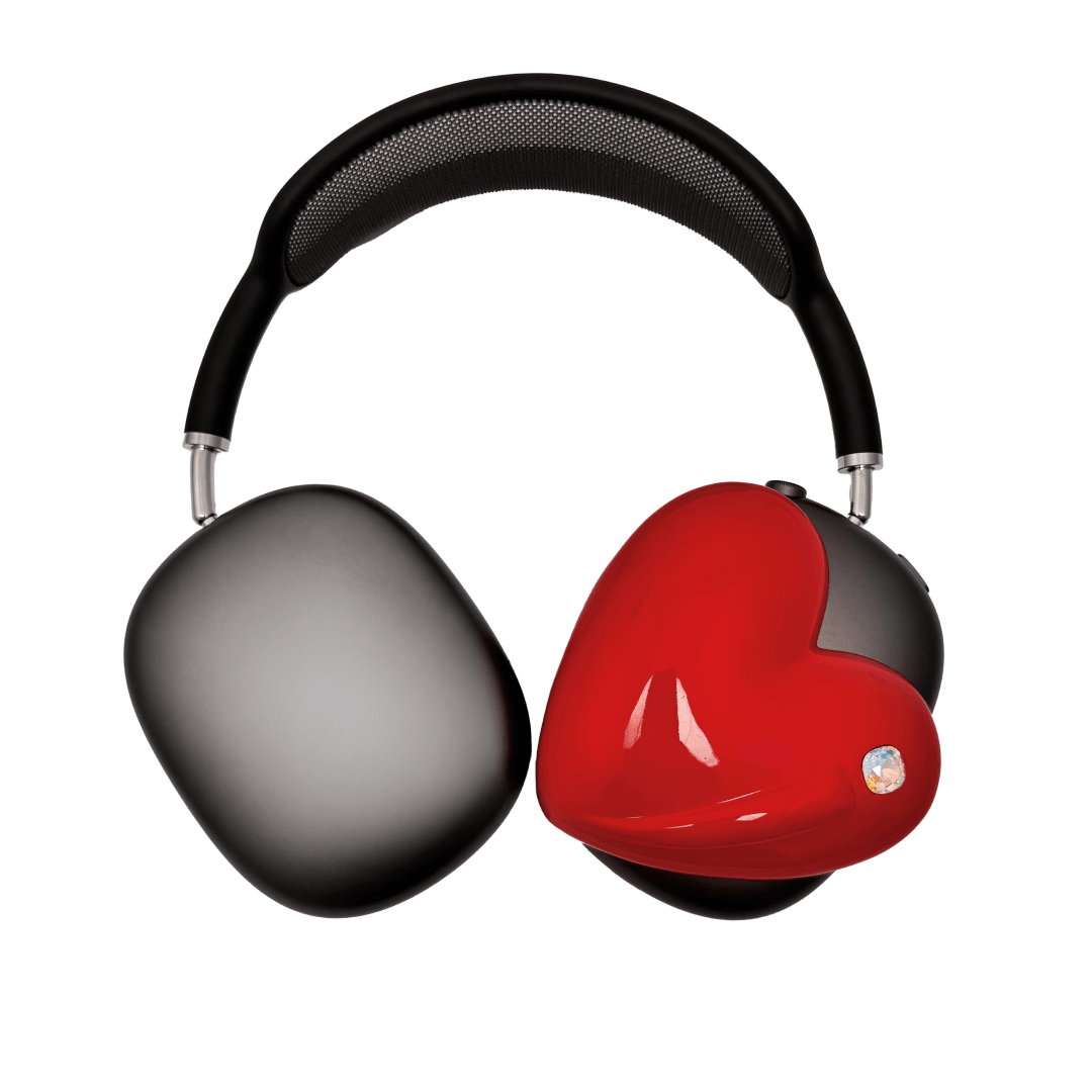 Metallic heart-shaped AirPods Max cover in silver, pink, red and black, with a smooth 3D sculpted surface and a single crystal stud detail.