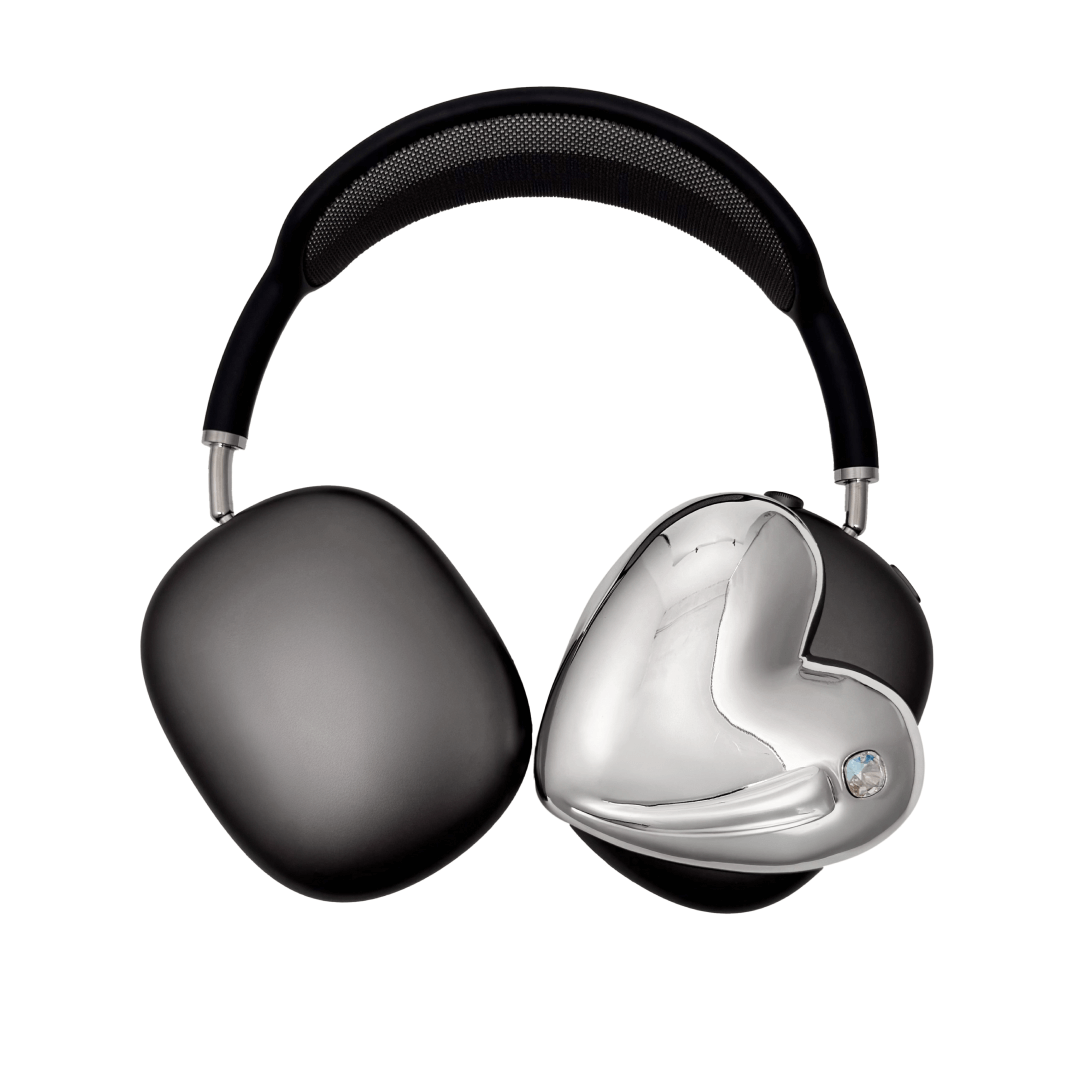 Metallic heart-shaped AirPods Max cover in silver, pink, red and black, with a smooth 3D sculpted surface and a single crystal stud detail.